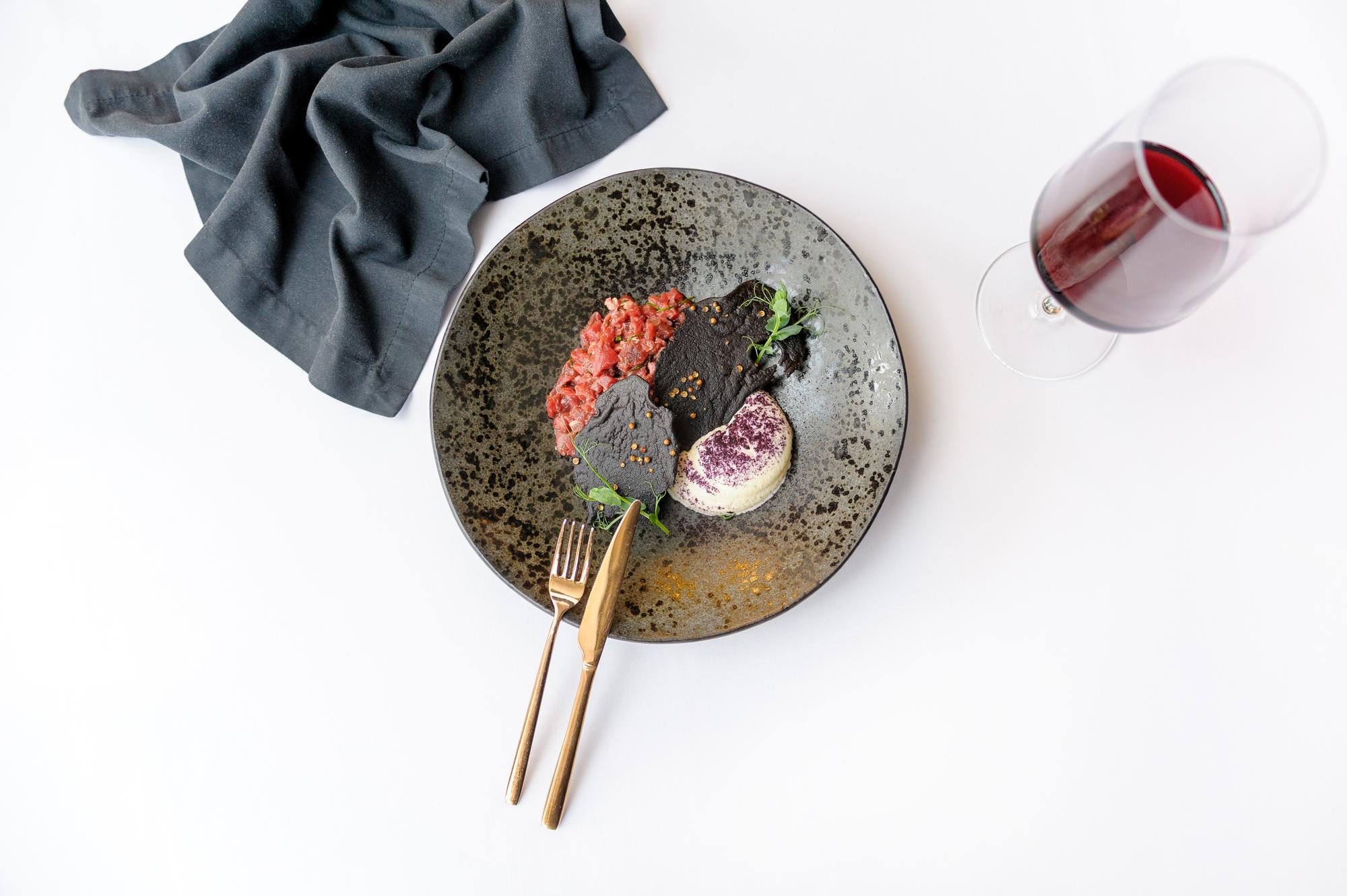 Large editorial shot of plated tasting menu